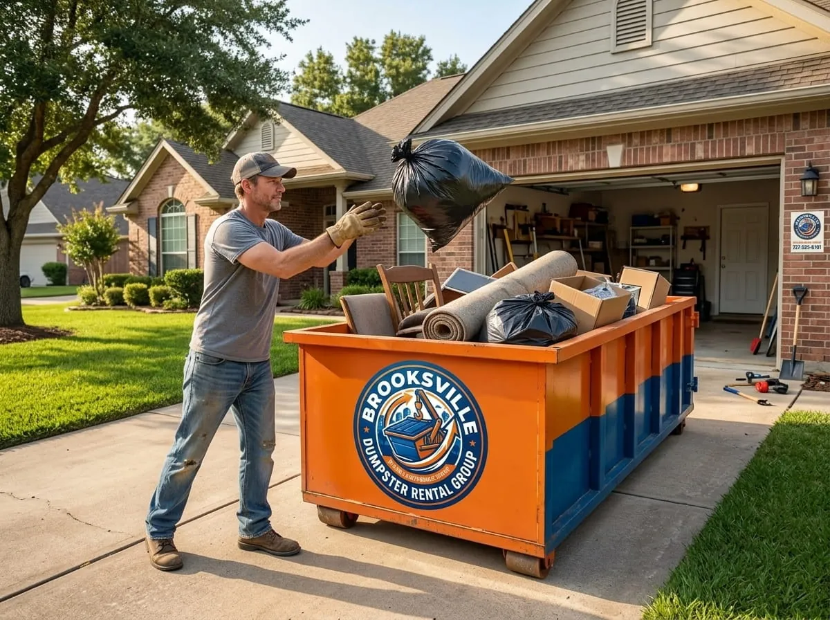 Worker beside a commercial roll-off dumpster from Brooksville Dumpster Rental Group in Brooksville, FL